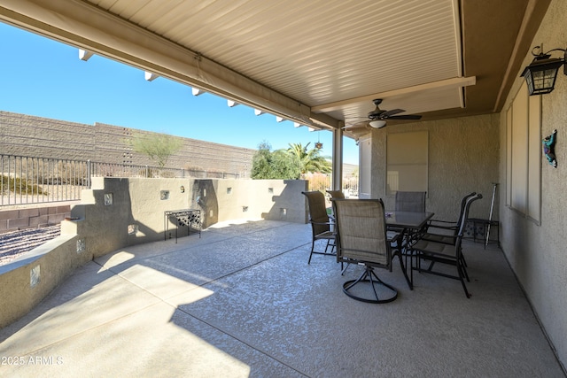 view of patio with ceiling fan