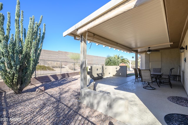 view of patio featuring ceiling fan