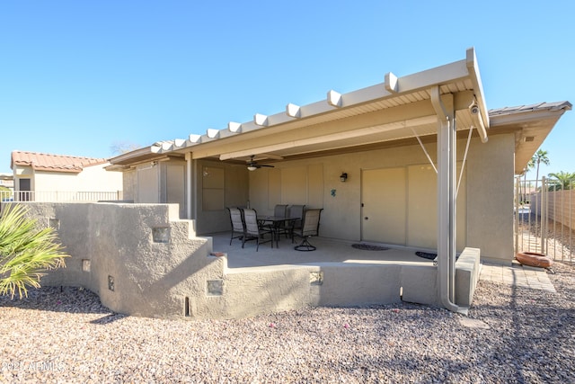 back of house featuring ceiling fan and a patio