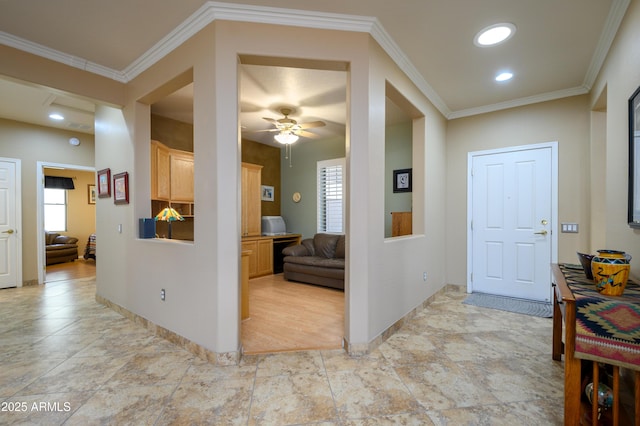 hallway featuring a wealth of natural light and crown molding