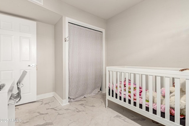 unfurnished bedroom featuring a crib