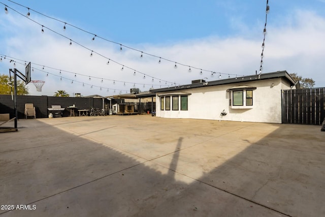 rear view of property featuring a patio