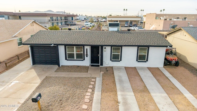 single story home with a garage