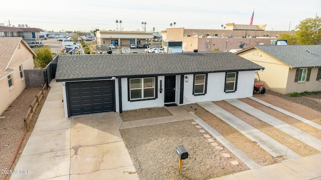 ranch-style home featuring a garage