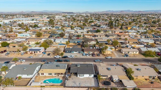 birds eye view of property featuring a mountain view