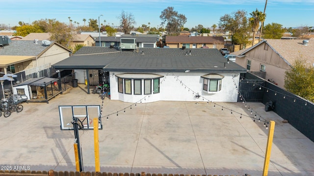 back of property with basketball court