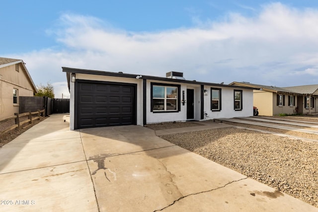 ranch-style home featuring a garage