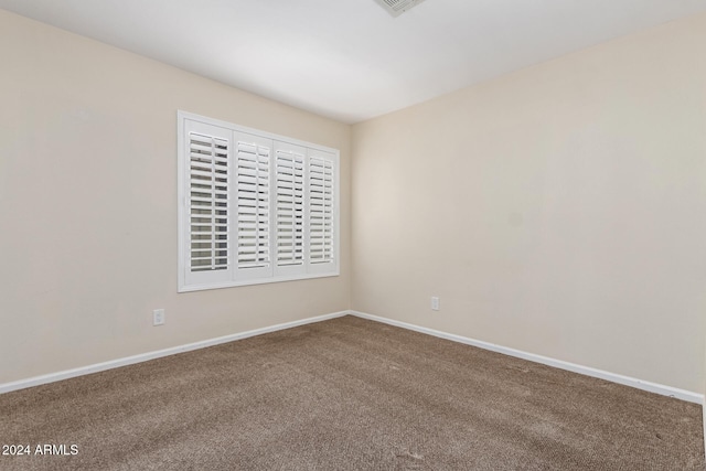 spare room with carpet floors