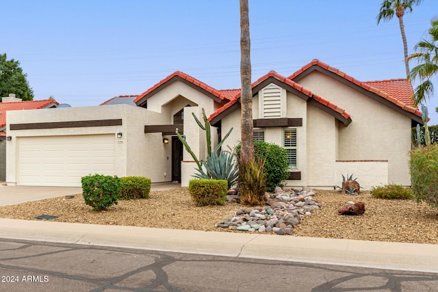 view of front of home with a garage