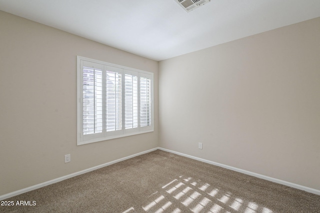 11085 E Becker Ln E, Scottsdale, AZ 85259 - spare room featuring carpet floors and baseboards