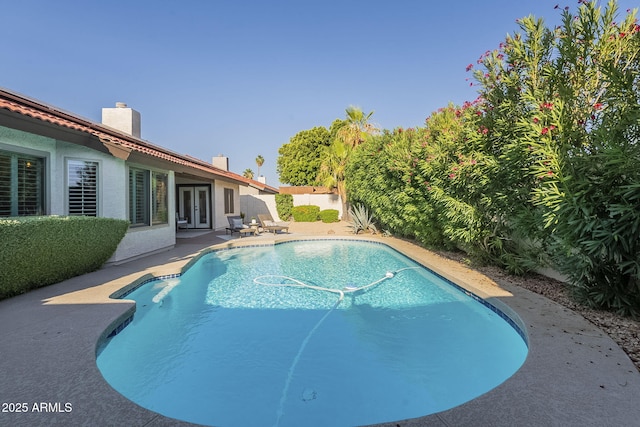 11085 E Becker Ln E, Scottsdale, AZ 85259 - view of pool featuring french doors, a patio, and a fenced backyard