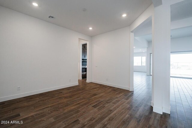 empty room featuring dark hardwood / wood-style floors