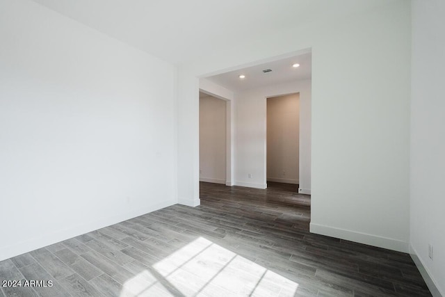 unfurnished room with wood-type flooring