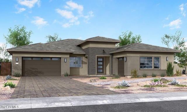 prairie-style house featuring a garage