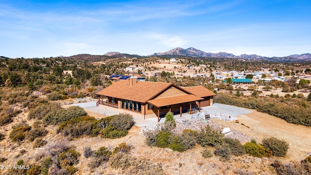 drone / aerial view featuring a mountain view