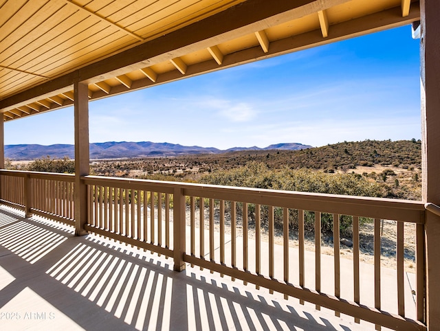 wooden deck with a mountain view