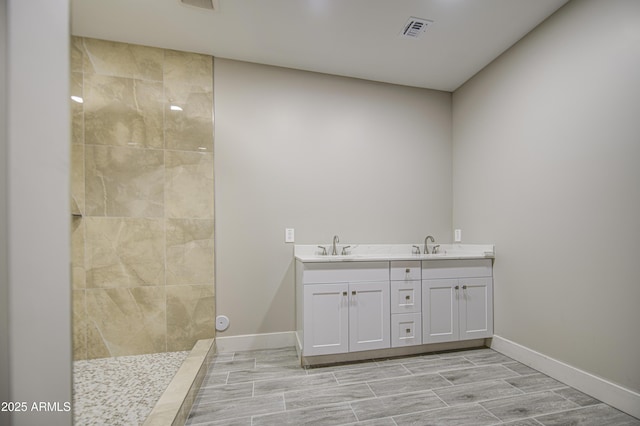 5945 W Lamar Rd, Glendale, AZ 85301 - full bath featuring double vanity, a walk in shower, baseboards, and wood finish floors