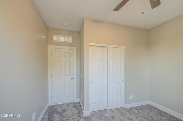 5945 W Lamar Rd, Glendale, AZ 85301 - unfurnished bedroom with carpet flooring, a closet, baseboards, and a ceiling fan