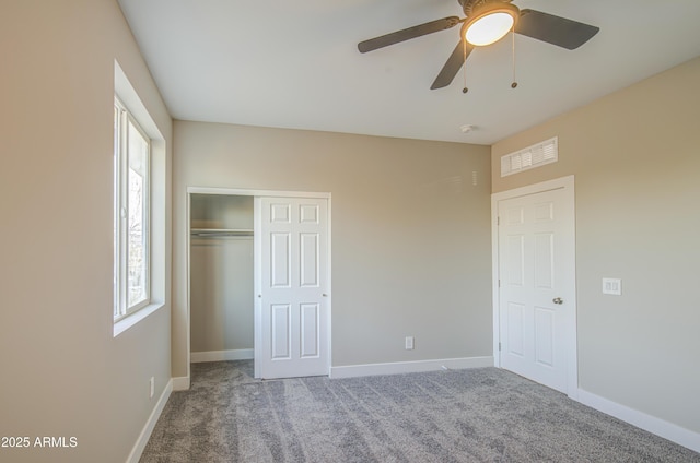 5945 W Lamar Rd, Glendale, AZ 85301 - unfurnished bedroom featuring carpet floors, a closet, baseboards, and a ceiling fan