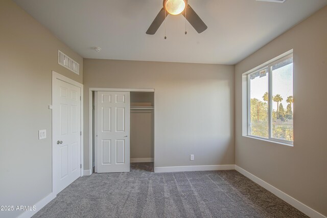 5945 W Lamar Rd, Glendale, AZ 85301 - unfurnished bedroom featuring carpet flooring, a closet, baseboards, and ceiling fan