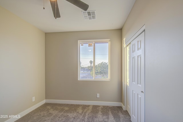 5945 W Lamar Rd, Glendale, AZ 85301 - unfurnished bedroom featuring carpet, baseboards, a closet, and a ceiling fan