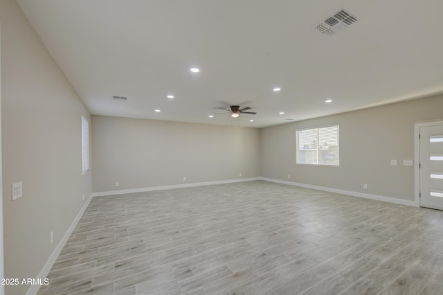 5945 W Lamar Rd, Glendale, AZ 85301 - empty room featuring ceiling fan, light wood-style flooring, recessed lighting, and baseboards