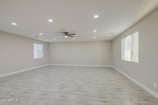 5945 W Lamar Rd, Glendale, AZ 85301 - empty room with ceiling fan, recessed lighting, baseboards, and light wood-style floors