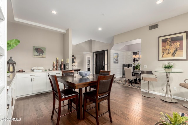 dining space featuring recessed lighting and dark wood-style floors