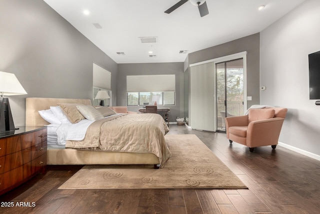 bedroom featuring access to outside, multiple windows, wood finished floors, and visible vents