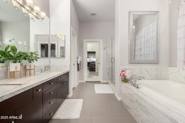 full bath with visible vents, a sink, a shower stall, double vanity, and a bath