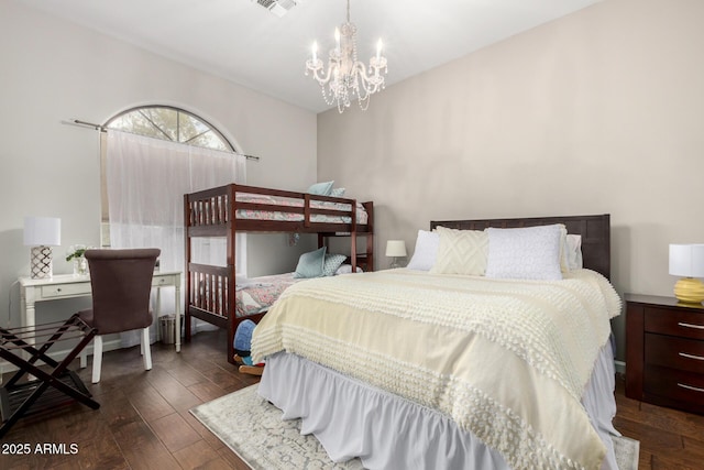 bedroom featuring visible vents, an inviting chandelier, and dark wood-style floors