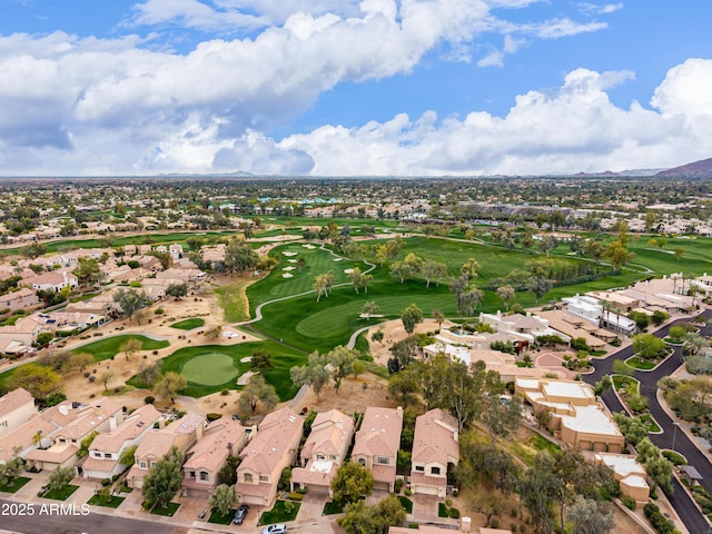 birds eye view of property with view of golf course and a residential view