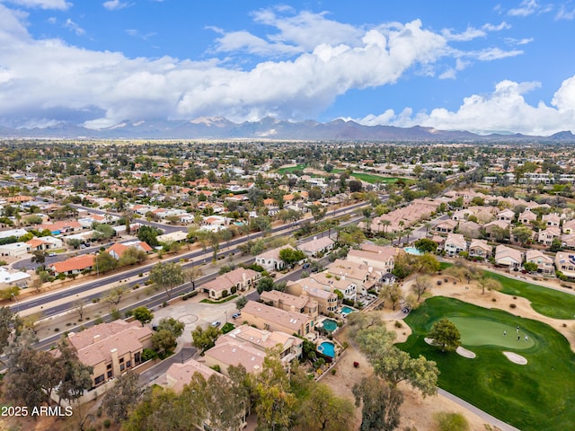 aerial view with a residential view, a mountain view, and view of golf course