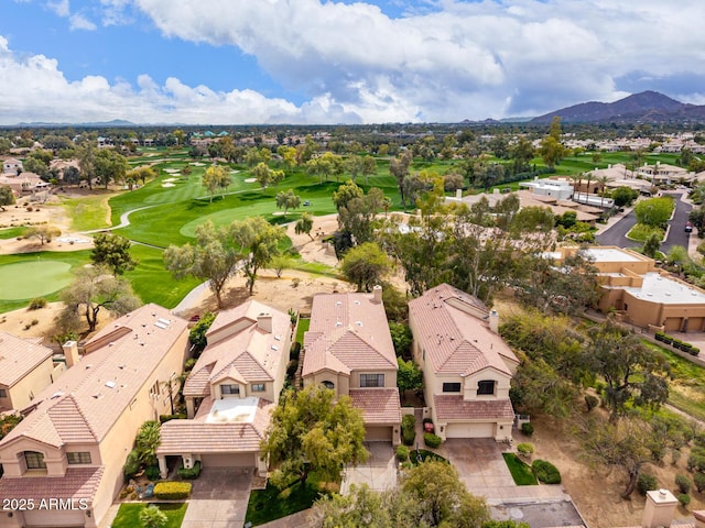 aerial view with a residential view, a mountain view, and golf course view