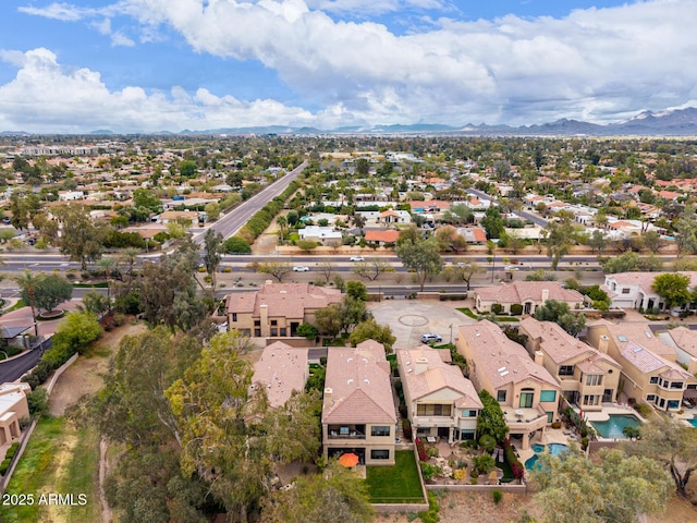 drone / aerial view with a residential view and a mountain view