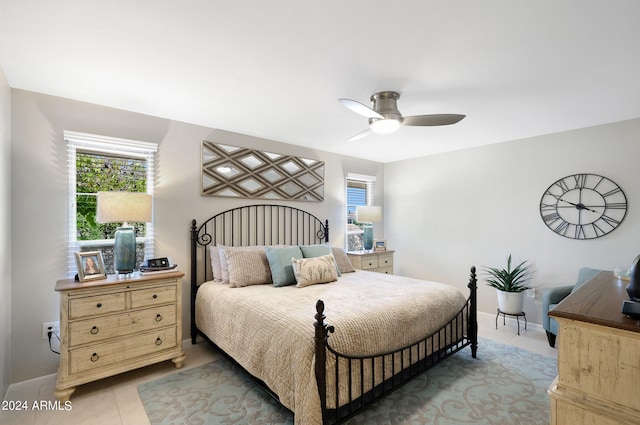 tiled bedroom with ceiling fan