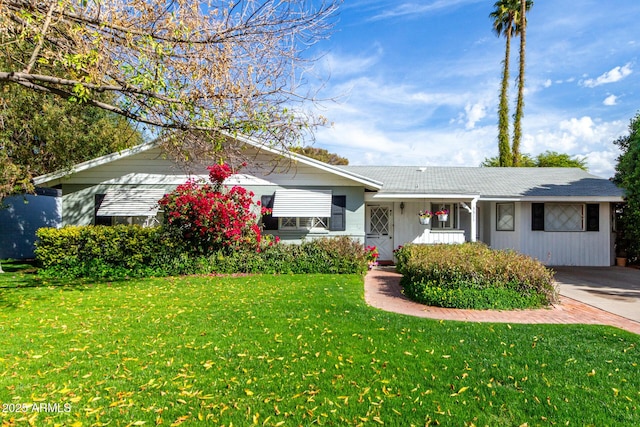 ranch-style house with a front lawn and a porch