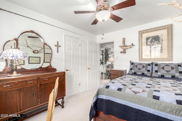 bedroom with light carpet and ceiling fan