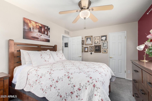 bedroom featuring ceiling fan and carpet