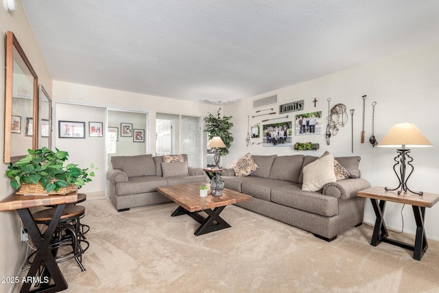 living room featuring light colored carpet