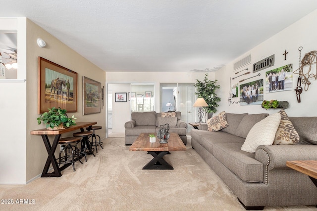 living room with light colored carpet