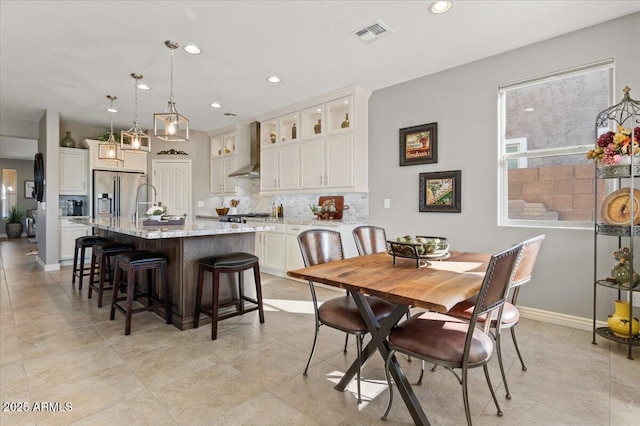 dining room with a healthy amount of sunlight and sink