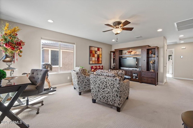 living room featuring light carpet and ceiling fan