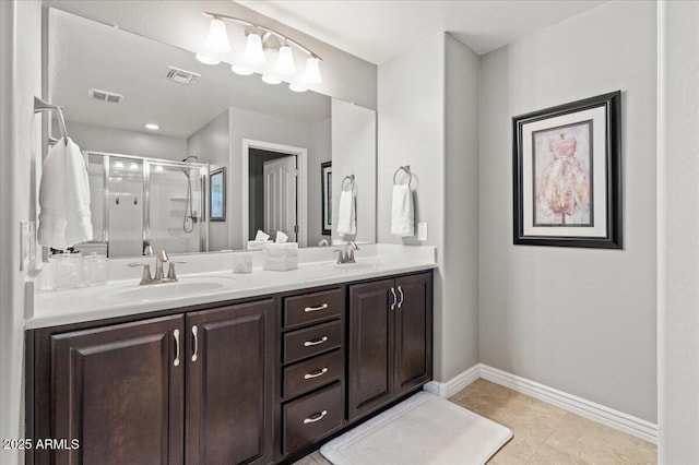 bathroom with vanity and an enclosed shower