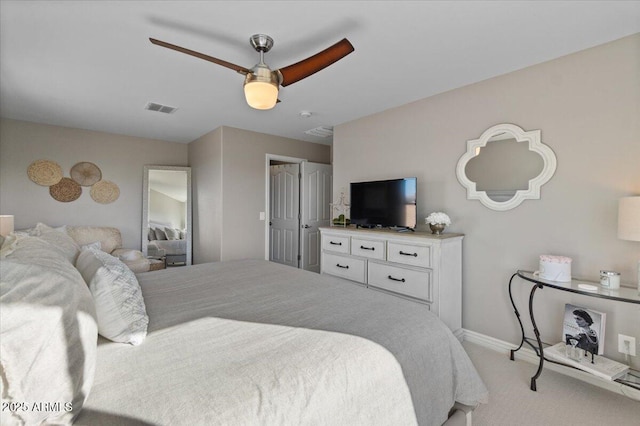 bedroom with light carpet and ceiling fan