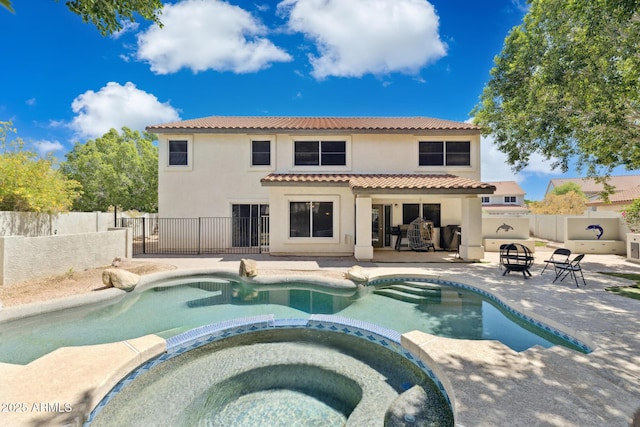 12748 N 57th Dr, Glendale, AZ 85304 - view of pool with a patio, a pool with connected hot tub, and a fenced backyard