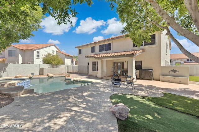 12748 N 57th Dr, Glendale, AZ 85304 - view of swimming pool featuring a fenced backyard, a patio area, and a pool with connected hot tub