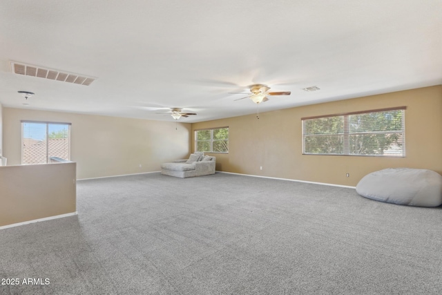 12748 N 57th Dr, Glendale, AZ 85304 - spare room featuring a ceiling fan, baseboards, and carpet flooring
