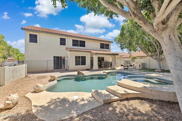 12748 N 57th Dr, Glendale, AZ 85304 - view of swimming pool featuring a patio, a fenced backyard, and a pool with connected hot tub