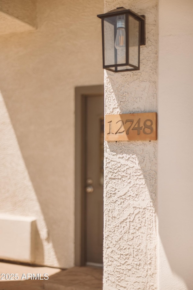 12748 N 57th Dr, Glendale, AZ 85304 - detailed view of stucco siding